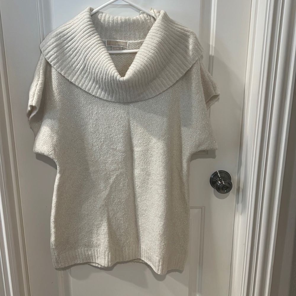 Cowl Neck Off-White Sweater With Silver Threads Running Through.
